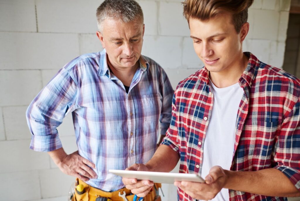 approach to the experienced carpenter and his younger employee